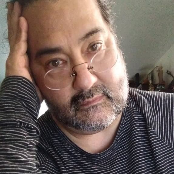 headshot of Robert René Galván 